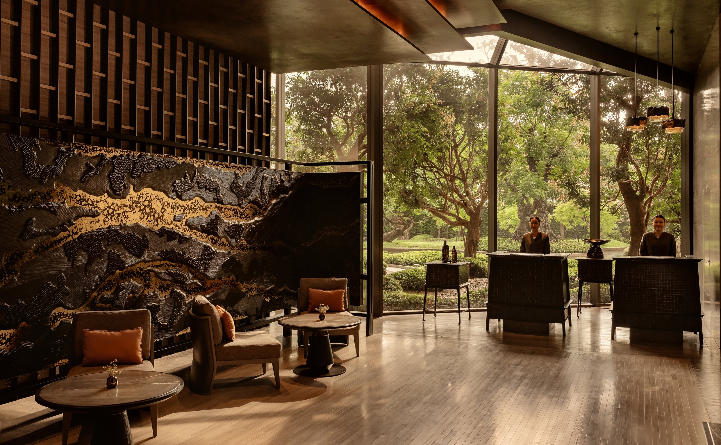 Aman Nai Lert Bangkok residence lobby with warm wood and park views