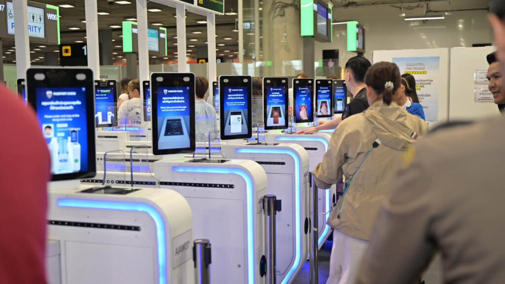 Travellers use biometric passport-control gates at Suvarnabhumi Airport