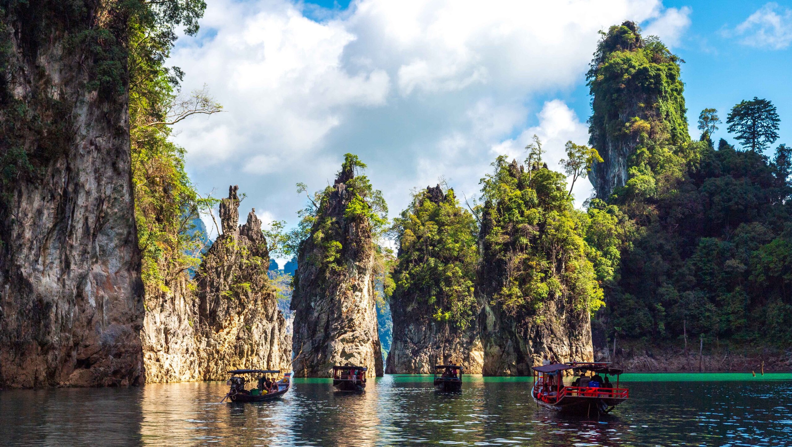 Official TAT image of long-tail boats at Khao Sok National Park for Thailand travel demand